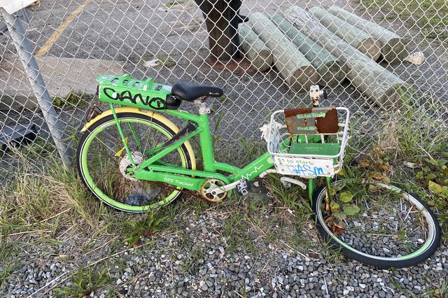 A broken down Lime bike on Rockaway beach